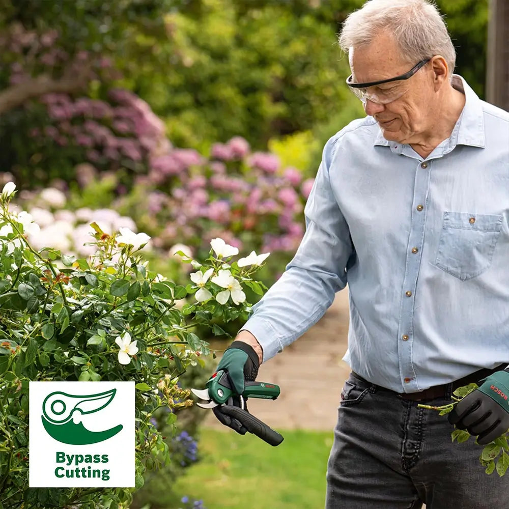 Man pruning plants in a garden with a 'Bypass Cutting' logo.