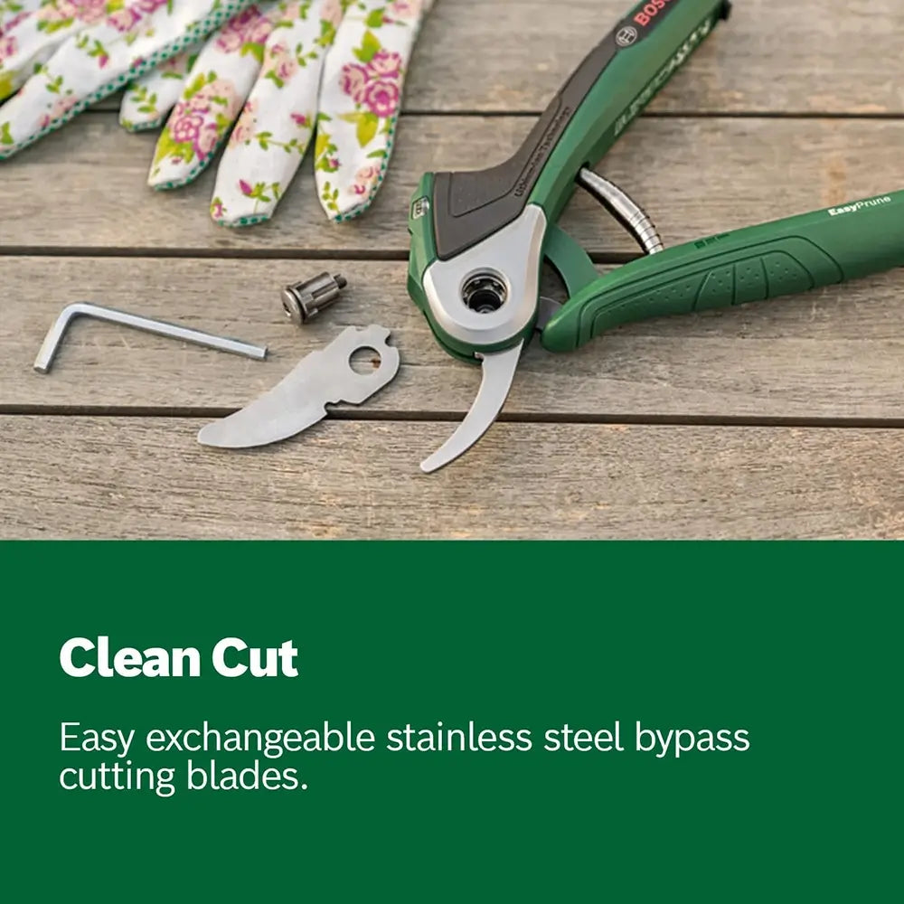 Gardening shears with interchangeable blades on a wooden surface, featuring gloves and tools.