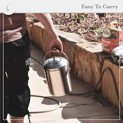 Person holding a stainless steel compost bin outdoors with text 'Easy To Carry'.
