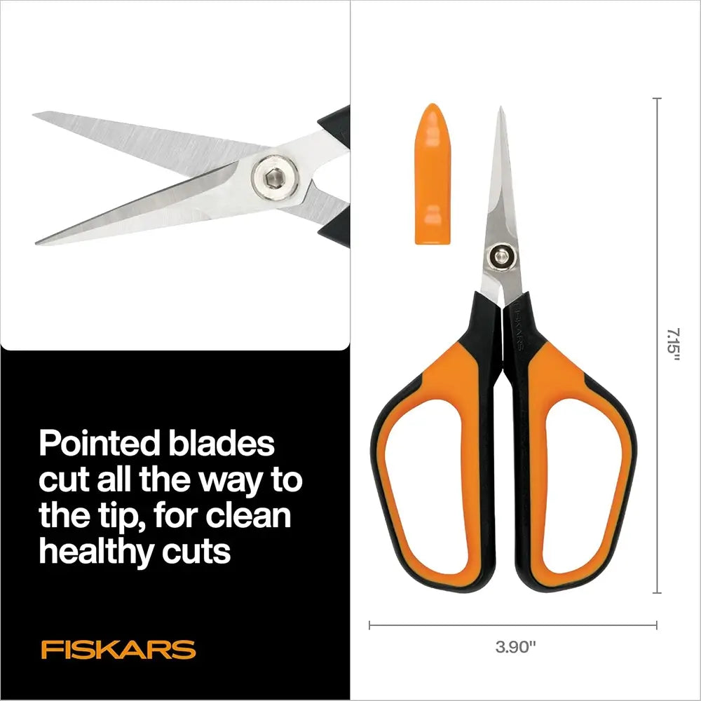 Fiskars scissors with orange handles and a measurement label on a white background