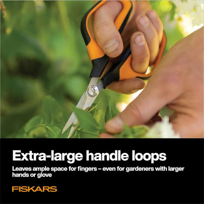 Person using Fiskars garden shears with text highlighting handle loops