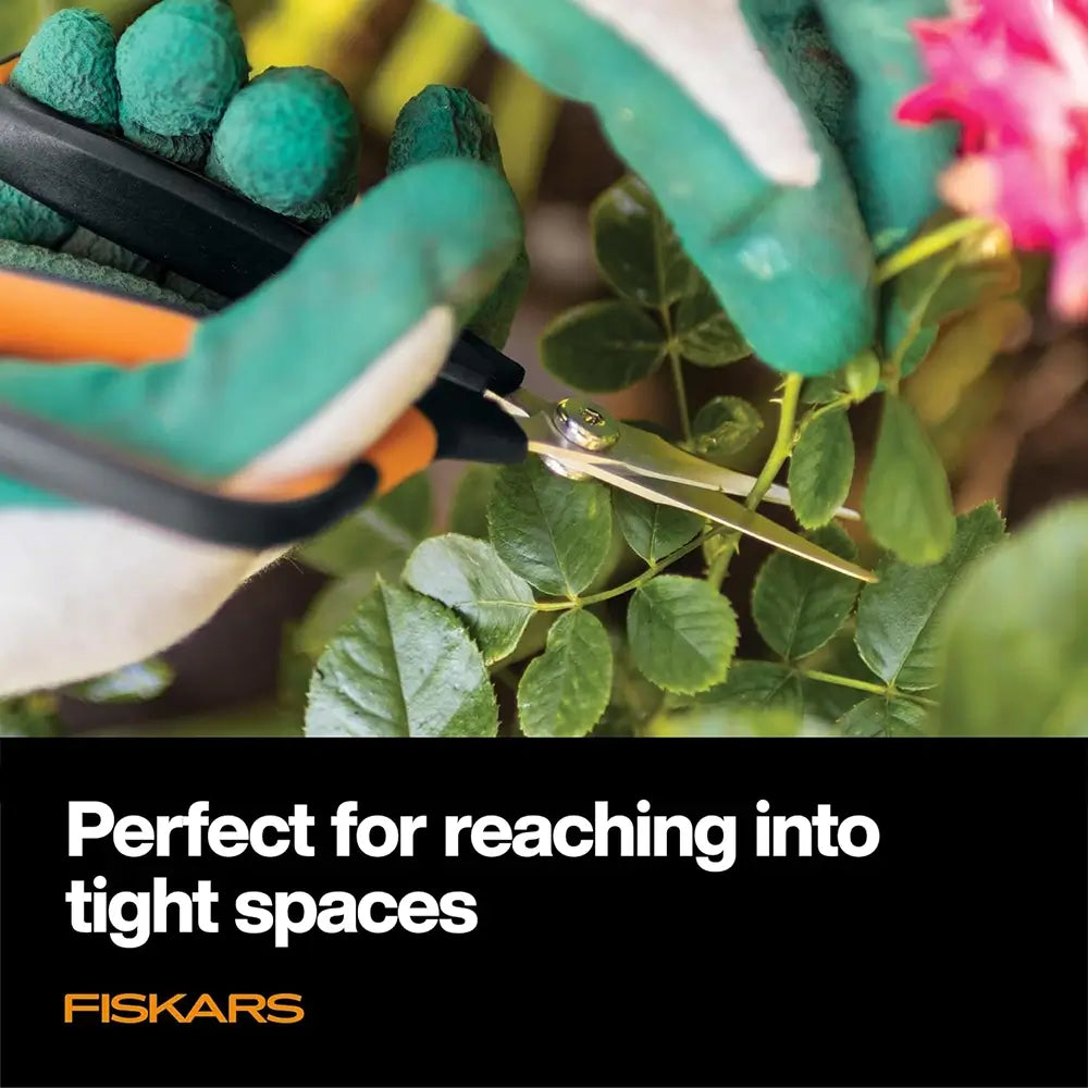 Gardening shears being used on a plant with text 'Perfect for reaching into tight spaces' and Fiskars logo.