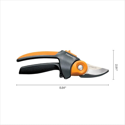 Gardening pruner with orange and black handles on a white background