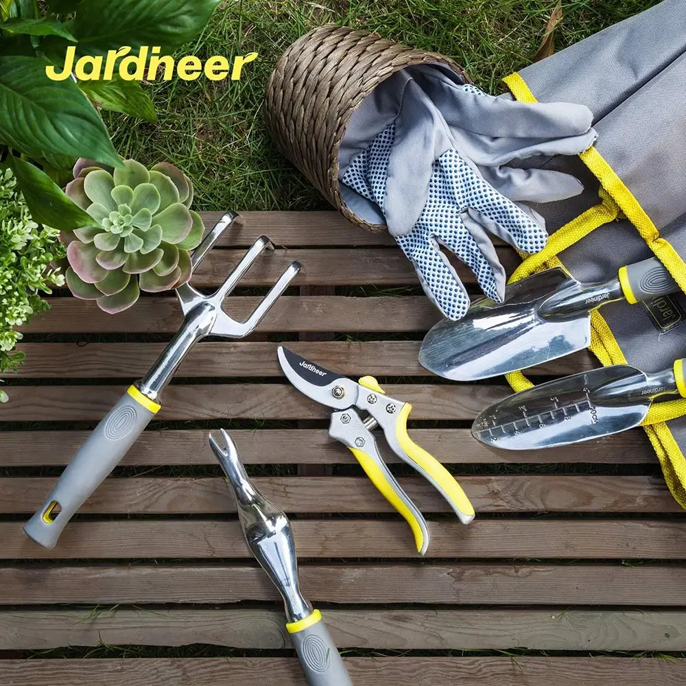 Gardening tools including pruners, trowels, and gloves on a wooden surface with 'Jardineer' branding.