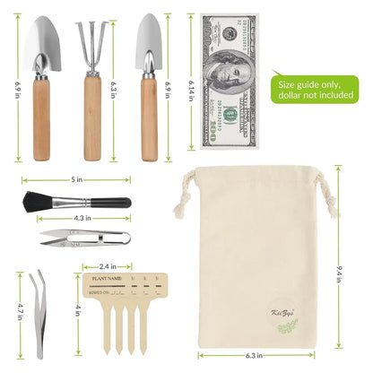 A gardening tool set with wooden and metal tools shown on a white background with green dimension lines and text indicating sizes. The set includes a hand trowel, soil fork, hand rake, scissors, tweezers, plant labels, and a drawstring pouch.