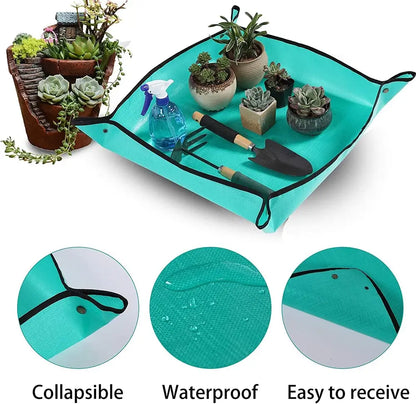 Gardening mat with plants, tools, and a spray bottle on a white background