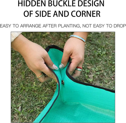 Person adjusting a green fabric with a hidden buckle design on a grassy background