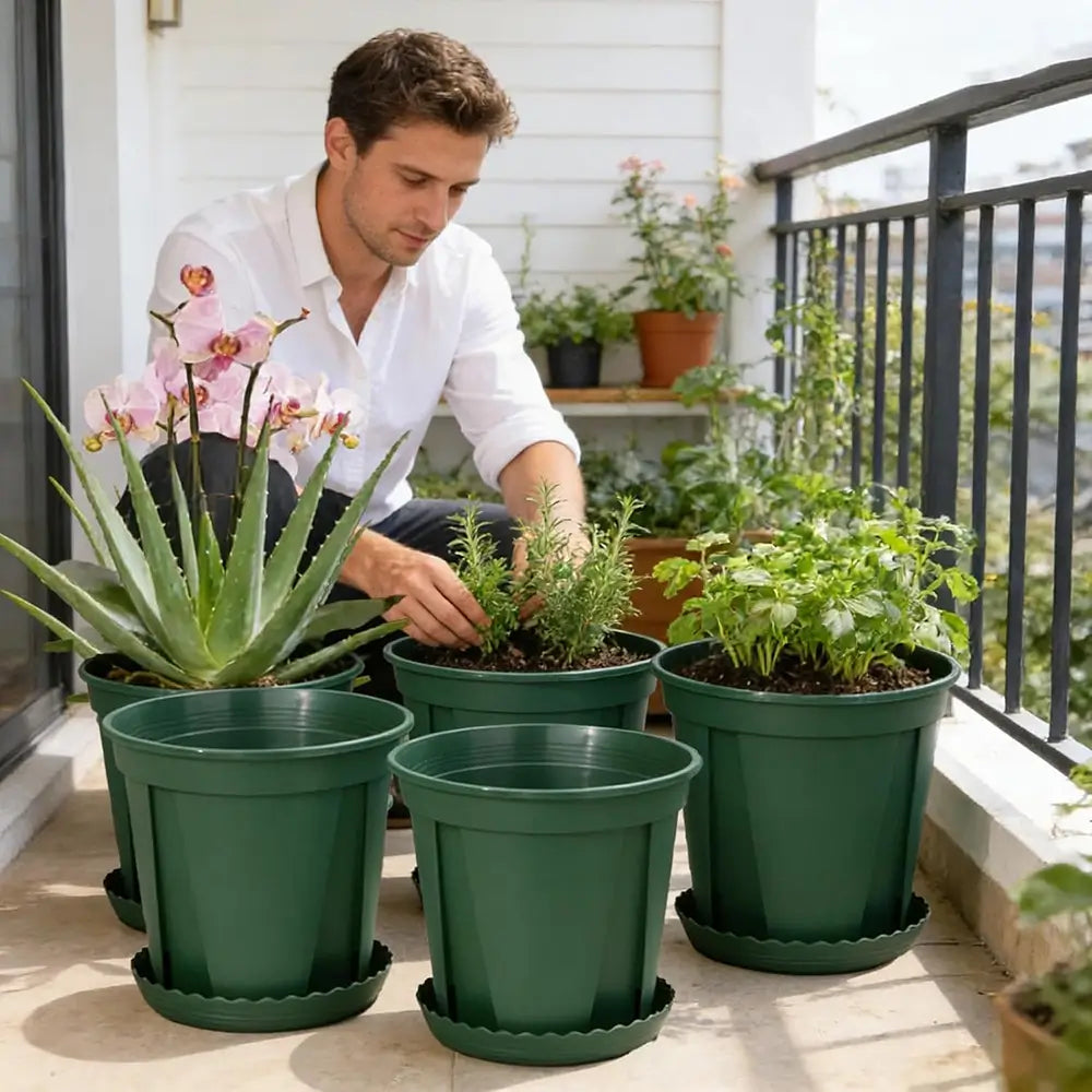Man tending to potted plants on a balcony
