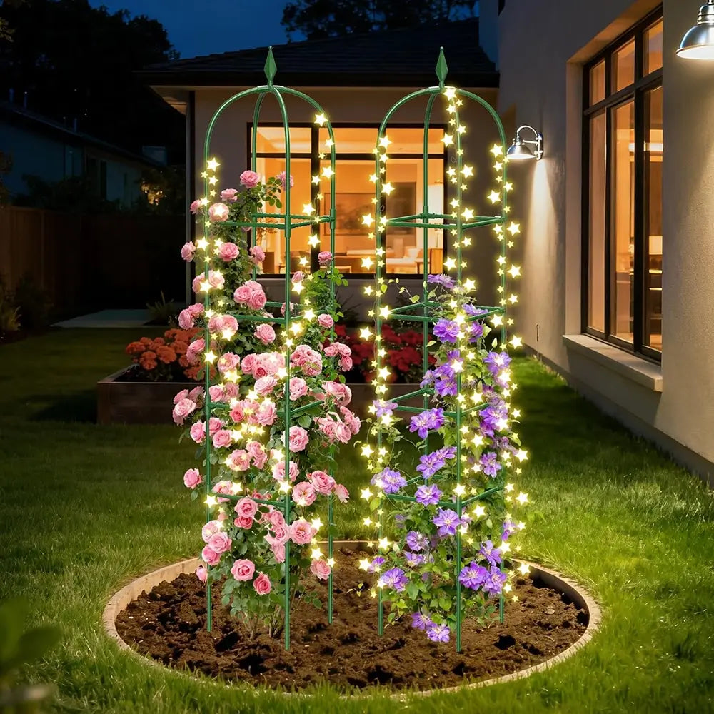 Decorative garden arch with flowers and string lights in a backyard setting.