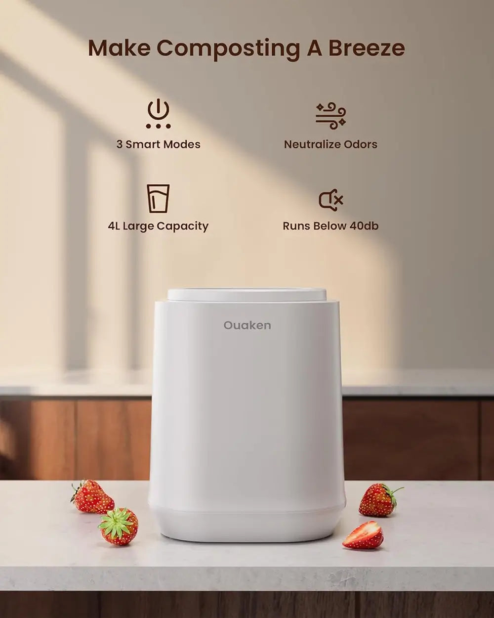 A white Quaken composting bin sits on a light countertop with strawberries around it. Above the product, marketing text reads 'Make Composting A Breeze' with icons and feature callouts: 3 Smart Modes, Neutralize Odors, 4L Large Capacity, and Runs Below 40db.